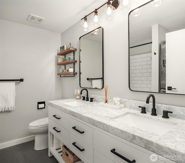 756 N 72nd St Unit 101, Seattle, WA 98103 - full bath with toilet, visible vents, a sink, and double vanity