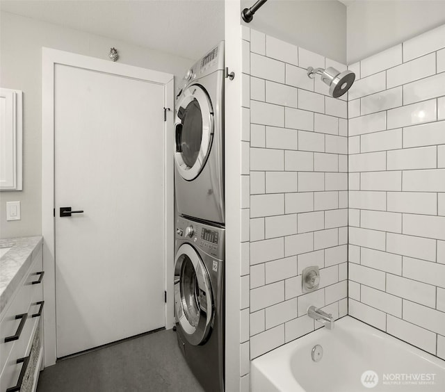 756 N 72nd St Unit 101, Seattle, WA 98103 - bathroom featuring vanity, shower / tub combination, and stacked washer and dryer