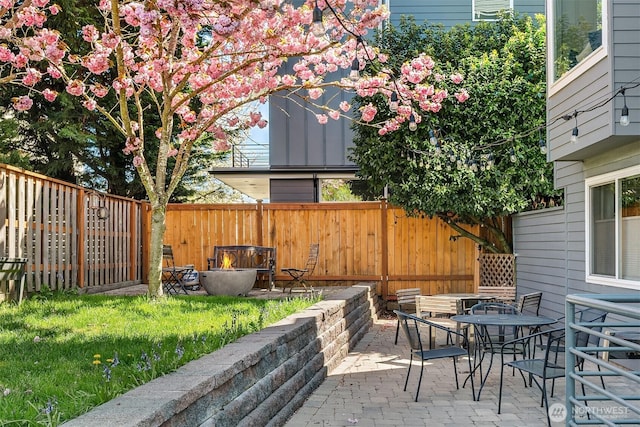756 N 72nd St Unit 101, Seattle, WA 98103 - view of patio / terrace with a fenced backyard