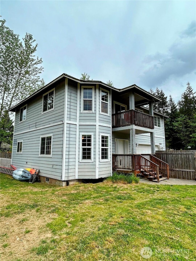 back of house featuring a balcony