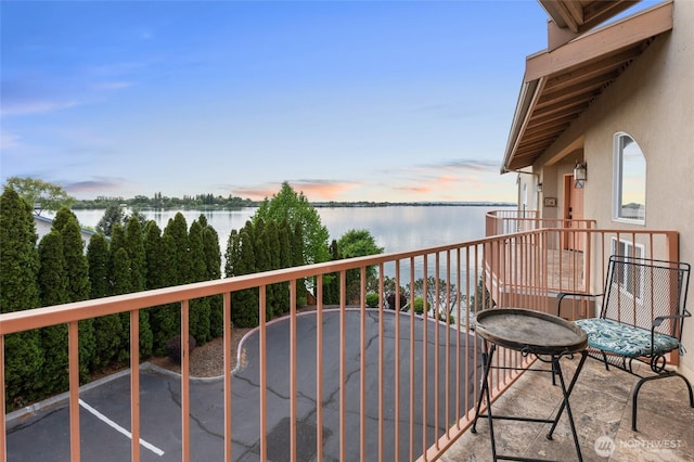 balcony featuring a water view