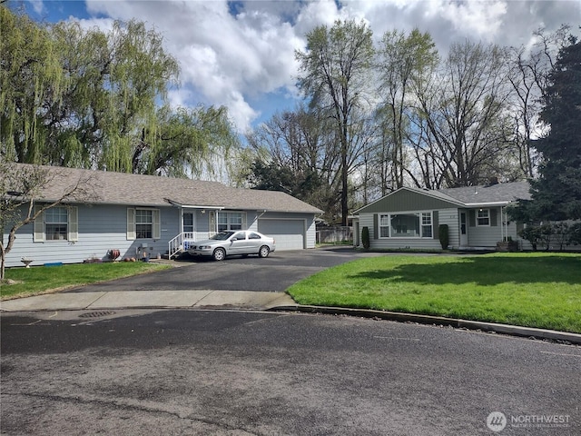 312 SE 9th St, College Place, WA 99324 - single story home with a front yard, a garage, and aphalt driveway