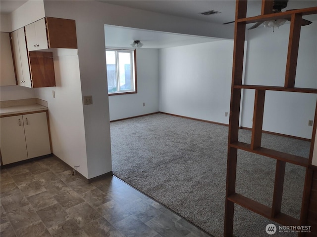 312 SE 9th St, College Place, WA 99324 - interior space featuring baseboards, carpet flooring, visible vents, and a ceiling fan