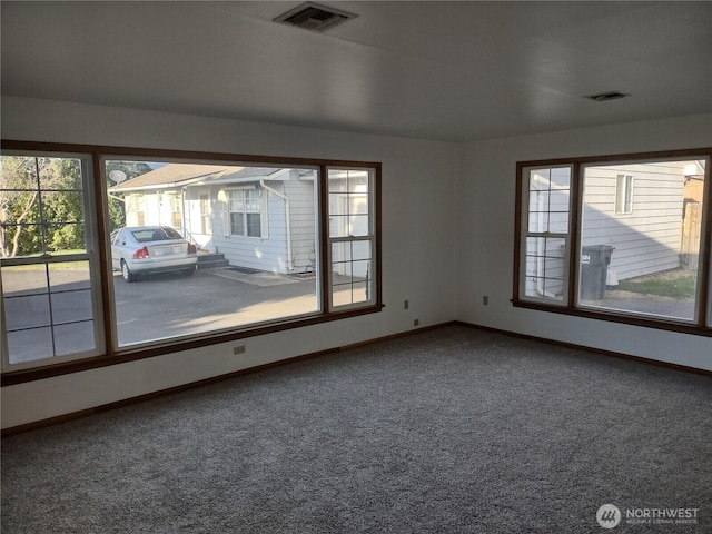 312 SE 9th St, College Place, WA 99324 - spare room with baseboards, carpet floors, and visible vents