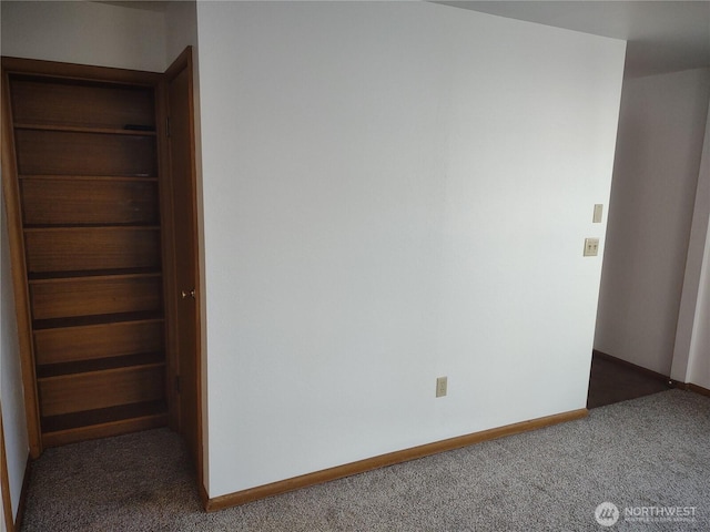 312 SE 9th St, College Place, WA 99324 - unfurnished bedroom with baseboards and carpet flooring