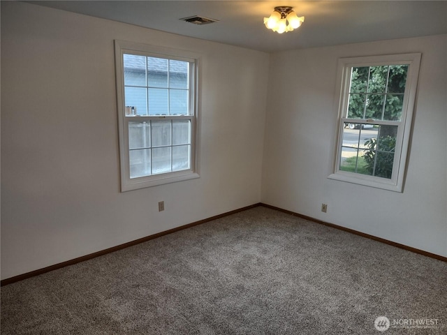 312 SE 9th St, College Place, WA 99324 - carpeted spare room featuring baseboards and visible vents