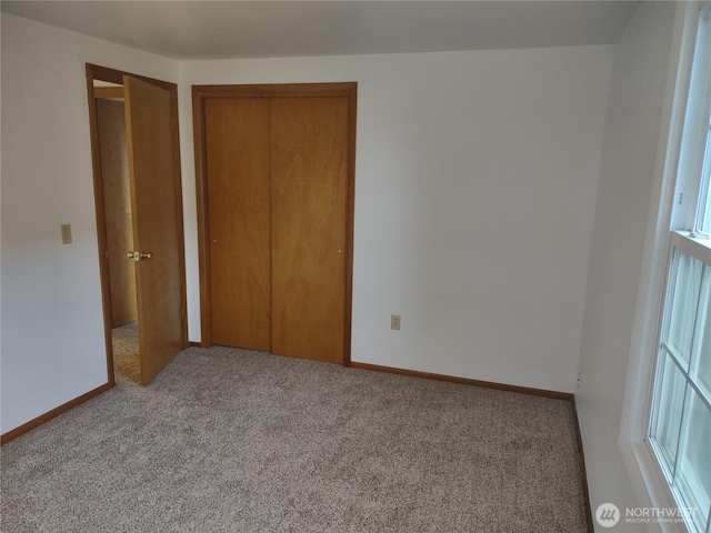312 SE 9th St, College Place, WA 99324 - unfurnished bedroom featuring carpet floors, baseboards, and a closet