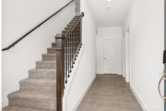 15710 210th Ave E Unit 311, Bonney Lake, WA 98391 - stairway with baseboards and tile patterned flooring