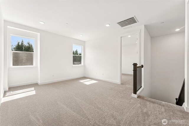 15710 210th Ave E Unit 311, Bonney Lake, WA 98391 - empty room featuring carpet floors, healthy amount of natural light, baseboards, and recessed lighting