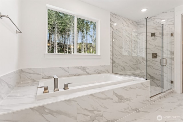 15710 210th Ave E Unit 311, Bonney Lake, WA 98391 - full bath featuring a garden tub, a marble finish shower, marble look tile flooring, and recessed lighting