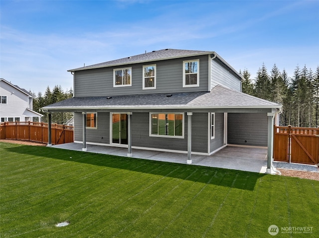 15710 210th Ave E Unit 311, Bonney Lake, WA 98391 - rear view of property featuring a patio, a shingled roof, and a gate