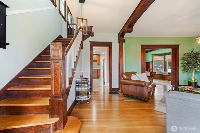 814 E Wright Ave, Tacoma, WA 98404 - stairs with wood finished floors and a chandelier