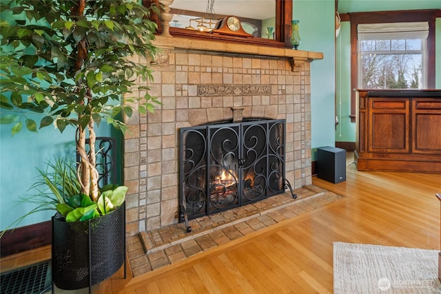 814 E Wright Ave, Tacoma, WA 98404 - detailed view of wood finished floors and a tile fireplace