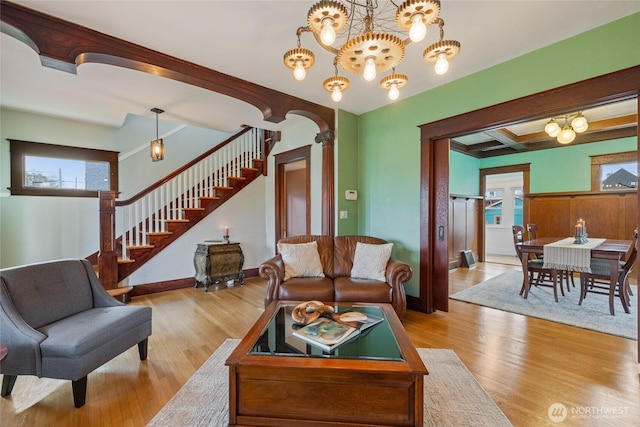 814 E Wright Ave, Tacoma, WA 98404 - living area with stairway, wood finished floors, and a chandelier