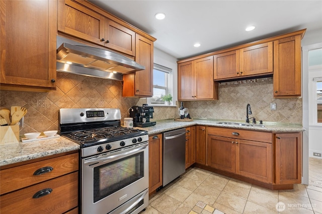 814 E Wright Ave, Tacoma, WA 98404 - kitchen featuring stainless steel appliances, under cabinet range hood, brown cabinets, and recessed lighting