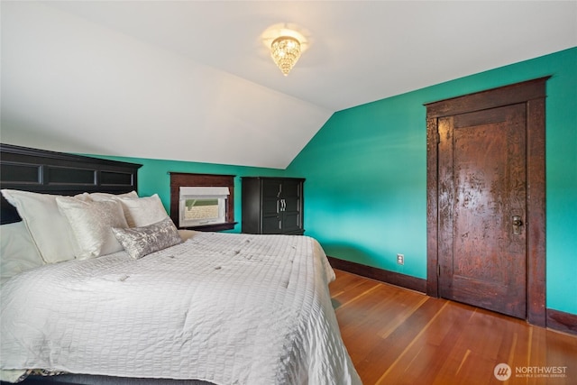814 E Wright Ave, Tacoma, WA 98404 - bedroom featuring vaulted ceiling and wood finished floors