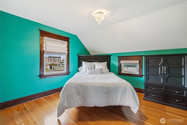 814 E Wright Ave, Tacoma, WA 98404 - bedroom with vaulted ceiling, light wood finished floors, and cooling unit