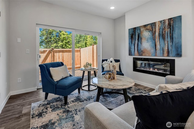 8818 NE 173rd Pl Unit B, Bothell, WA 98011 - living area with wood finished floors, baseboards, recessed lighting, and a glass covered fireplace