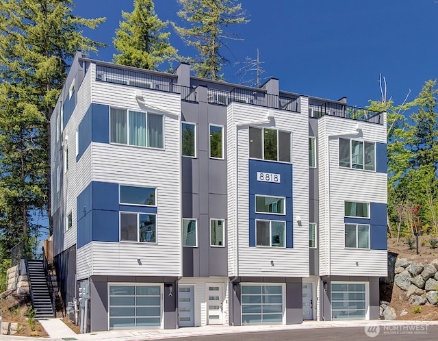 8818 NE 173rd Pl Unit B, Bothell, WA 98011 - view of apartment building / complex with an attached garage and stairway