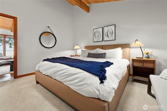 449 Madrona Dr, Friday Harbor, WA 98250 - bedroom with baseboards, vaulted ceiling with beams, wood ceiling, and light carpet