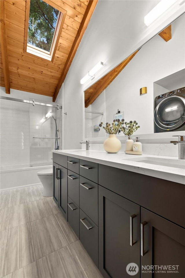 449 Madrona Dr, Friday Harbor, WA 98250 - bathroom with double vanity, wooden ceiling, lofted ceiling with skylight, and a sink