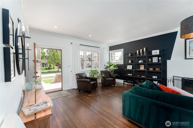 living room featuring recessed lighting, ornamental molding, and dark wood-style floors