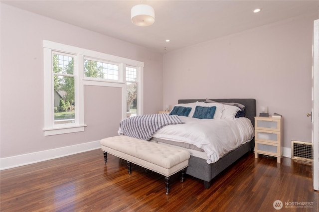 bedroom with baseboards, recessed lighting, dark wood-style floors, and visible vents
