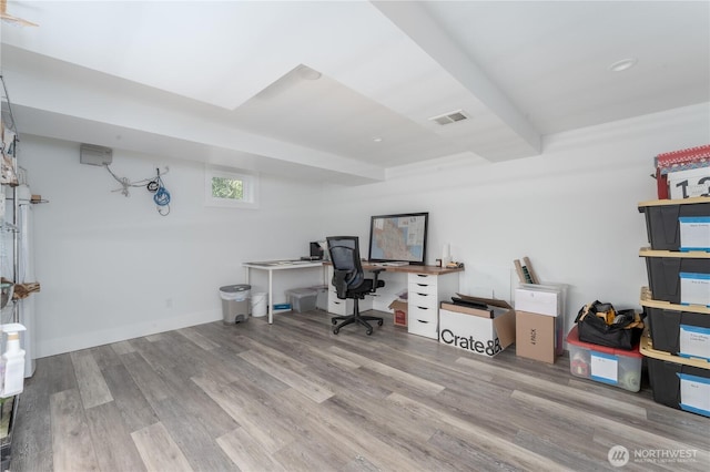 office area featuring wood finished floors and visible vents