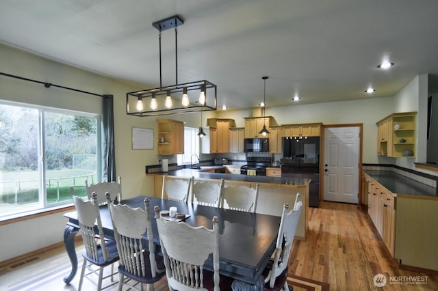 dining room with recessed lighting, visible vents, light wood-type flooring, and a healthy amount of sunlight