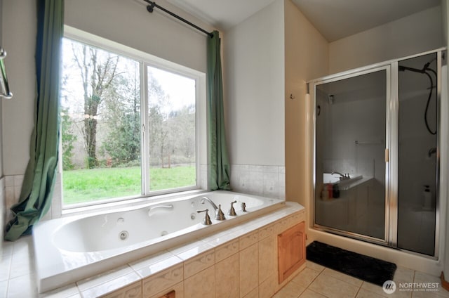 full bathroom featuring tile patterned flooring, a stall shower, and a tub with jets