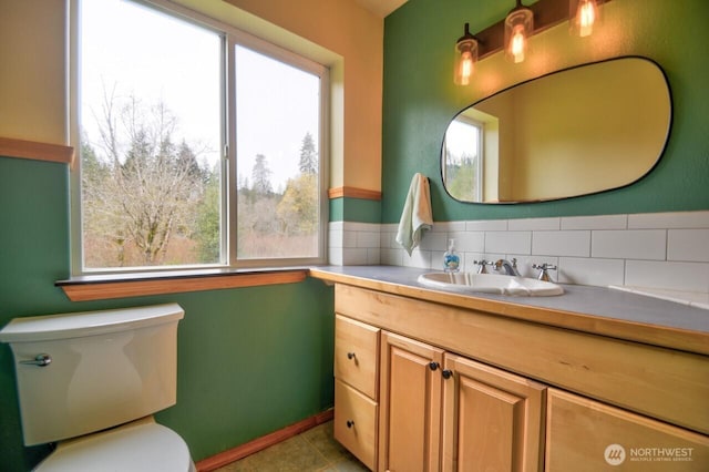 bathroom featuring tile patterned floors, vanity, and toilet