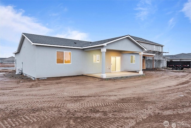 back of property with a patio area