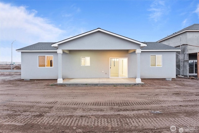 back of property with a patio area