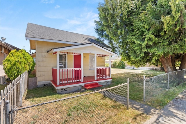 1330 Central Blvd, Centralia, WA 98531 - shotgun-style home with covered porch, a fenced front yard, and roof with shingles