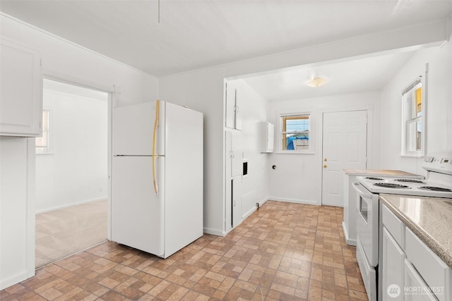 1330 Central Blvd, Centralia, WA 98531 - kitchen featuring white appliances, brick patterned flooring, light countertops, and white cabinetry