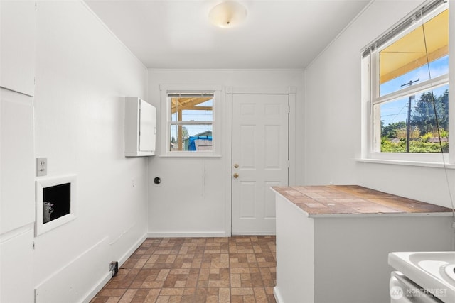 1330 Central Blvd, Centralia, WA 98531 - laundry area featuring brick patterned floors, plenty of natural light, and ornamental molding