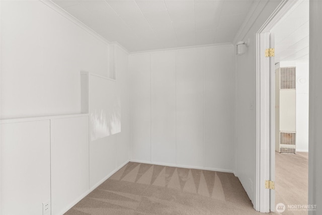 1330 Central Blvd, Centralia, WA 98531 - unfurnished room with a heating unit, carpet flooring, a decorative wall, and crown molding