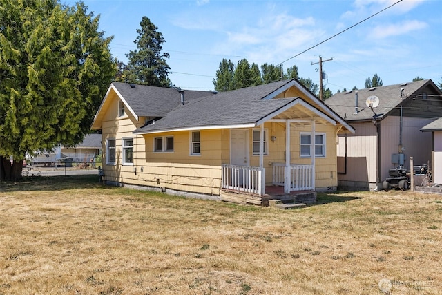 1330 Central Blvd, Centralia, WA 98531 - back of property featuring roof with shingles, a lawn, and a porch