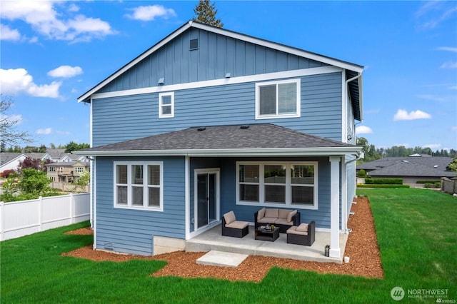 back of property featuring an outdoor living space, a patio, a yard, and fence