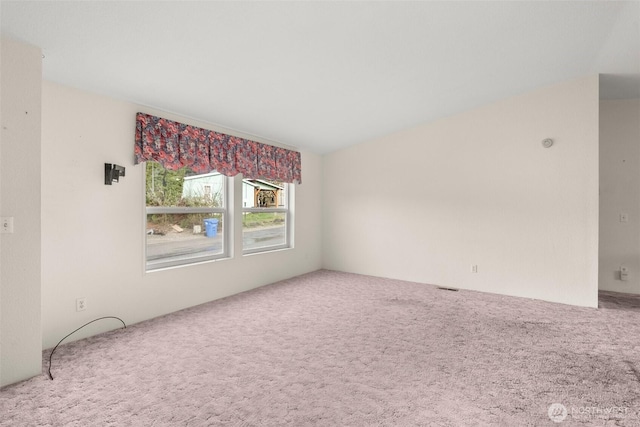unfurnished room featuring carpet floors