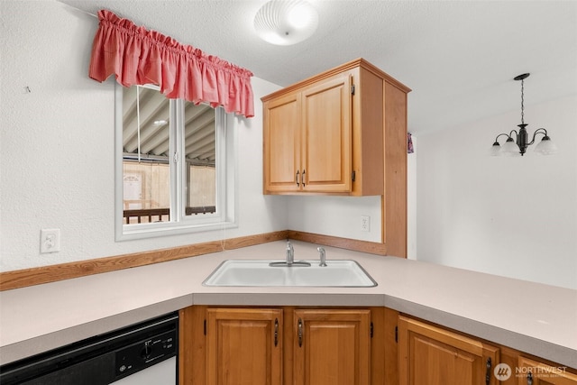 kitchen with a chandelier, dishwasher, light countertops, a sink, and hanging light fixtures