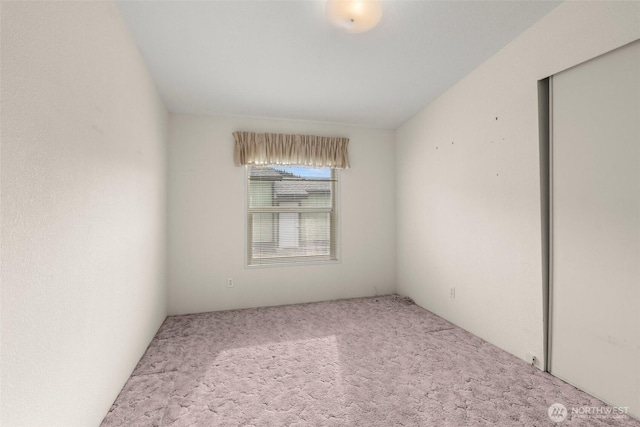 spare room featuring carpet
