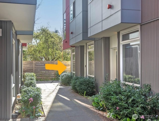 view of home's exterior featuring fence