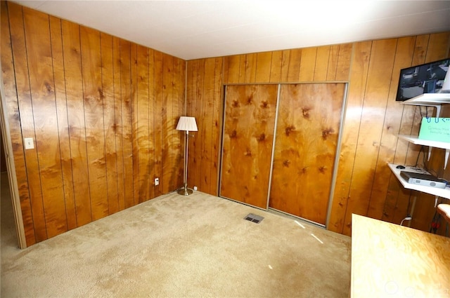 5115 88th Street Ct E Unit 29, Tacoma, WA 98446 - spare room featuring carpet floors, visible vents, and wood walls