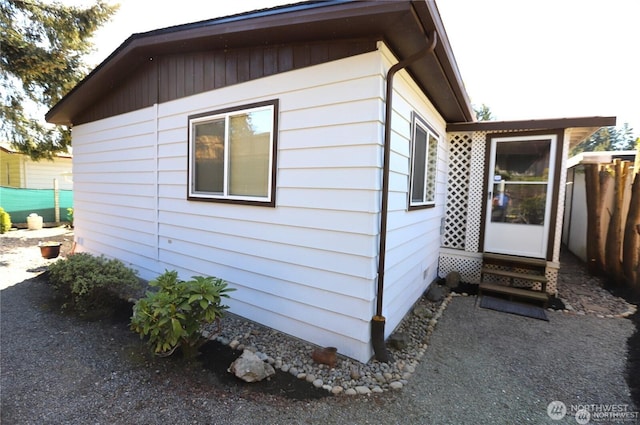 5115 88th Street Ct E Unit 29, Tacoma, WA 98446 - view of side of home featuring fence and entry steps