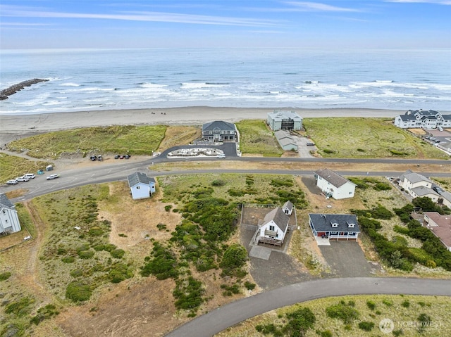 drone / aerial view with a view of the beach and a water view