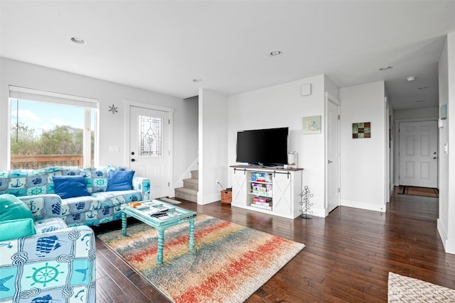 living area featuring baseboards, recessed lighting, stairway, and dark wood finished floors