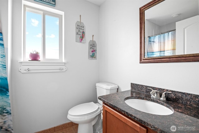 full bathroom featuring a shower with curtain, tile patterned flooring, vanity, and toilet