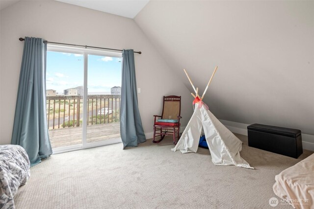 recreation room with carpet floors and vaulted ceiling