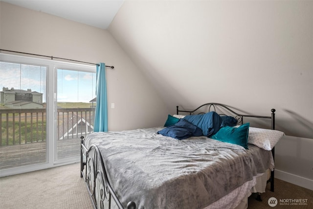 carpeted bedroom with baseboards, access to exterior, and vaulted ceiling